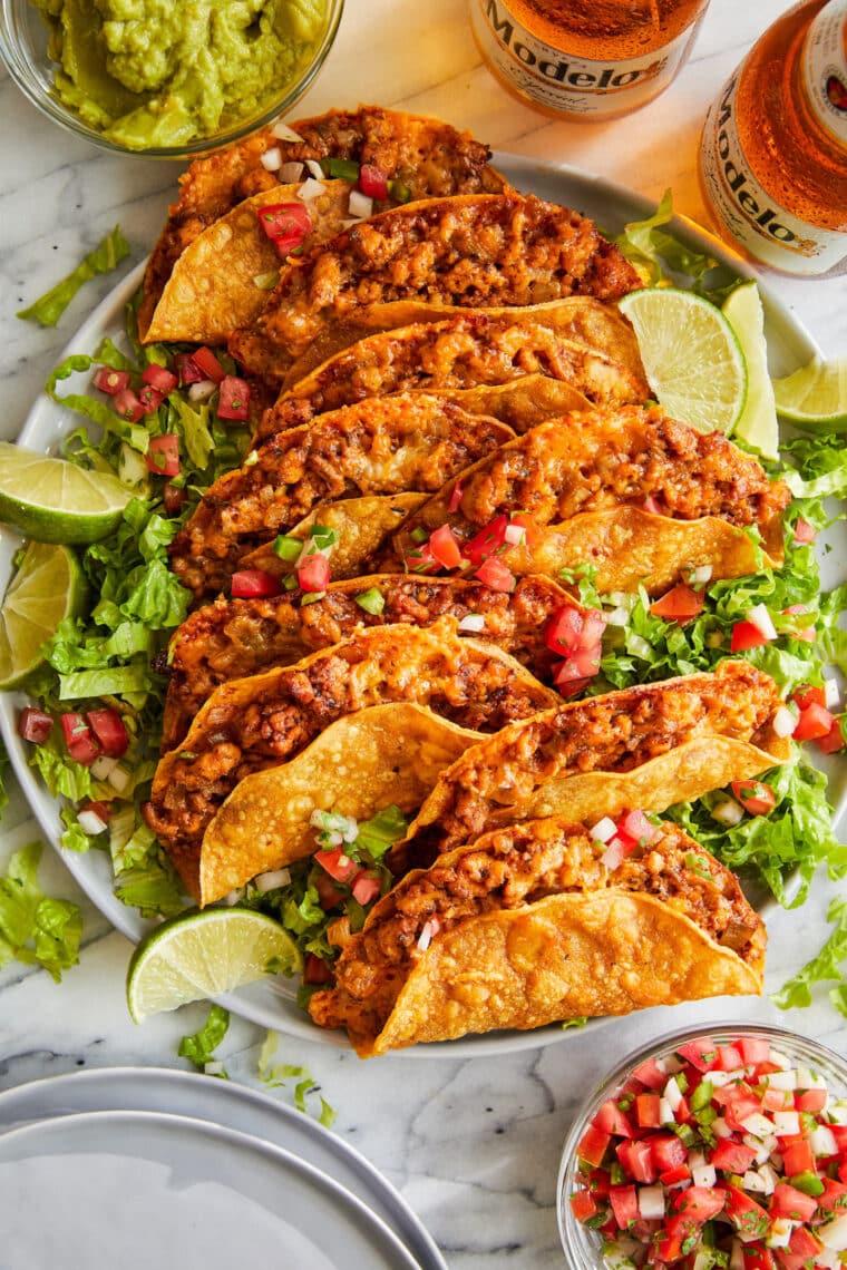 Crispy Baked Chicken Tacos - OH-SO-CRISP, crunchy, cheesy chicken tacos completely baked to absolute PERFECTION. A super easy weeknight meal!